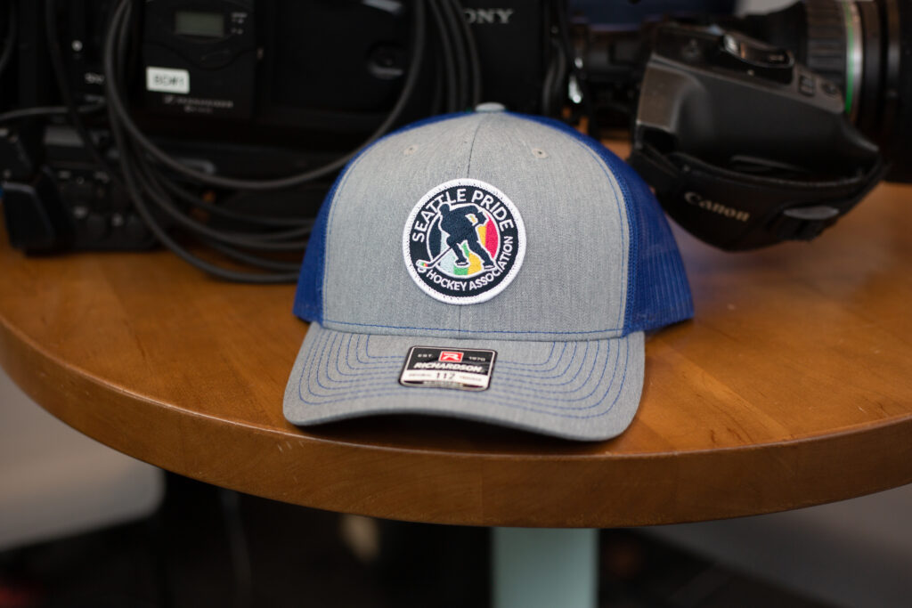 Grey trucker SPHA hat on display on a table